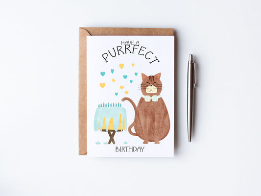 Hand illustrated brown cat sitting beside a big birthday cake wearing a bow with hearts - Have a purrfect birthday