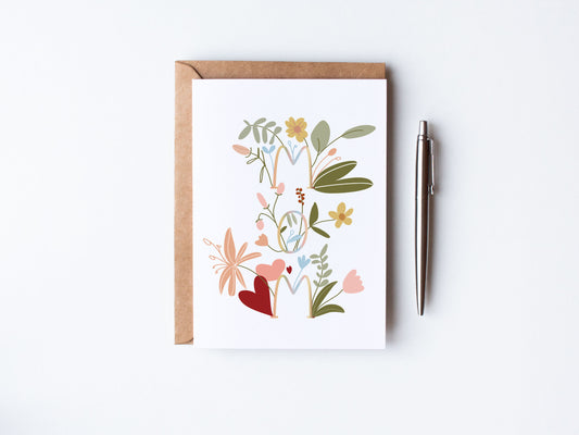Hand Illustrated florals coming out of the delicately written word mom