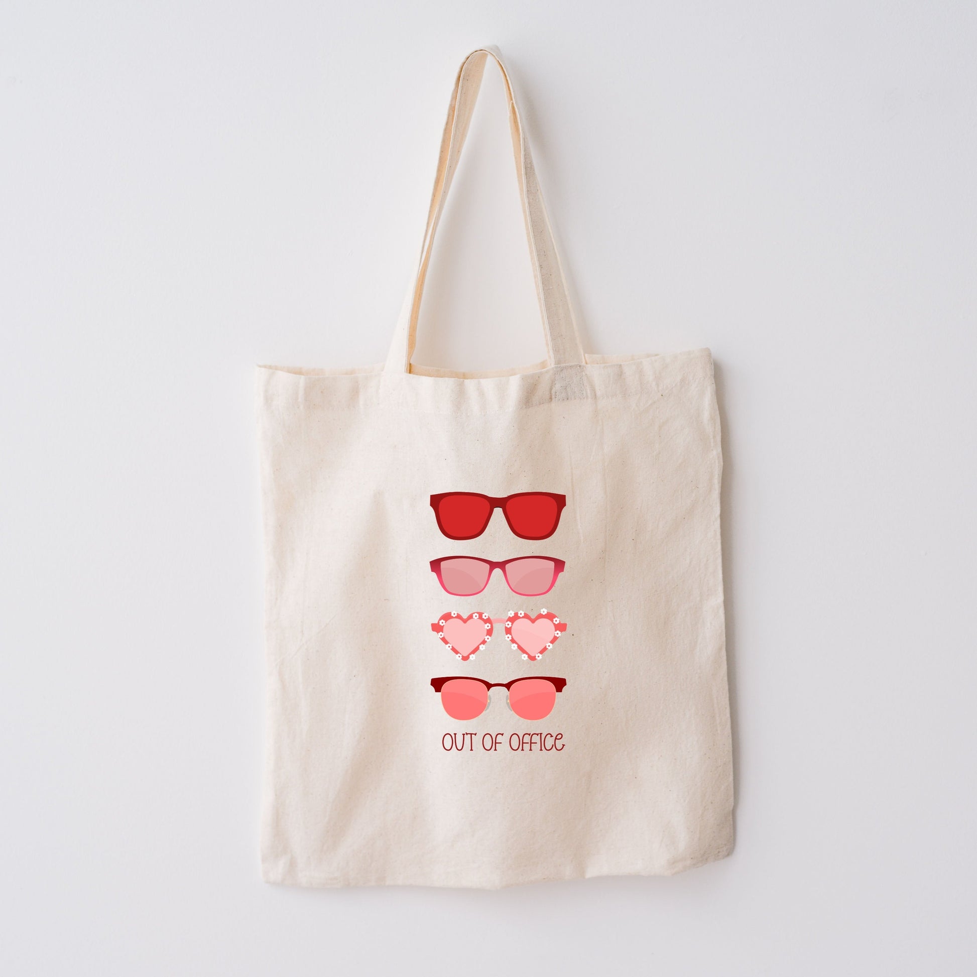 4 different pink and red sunglasses - says out of office