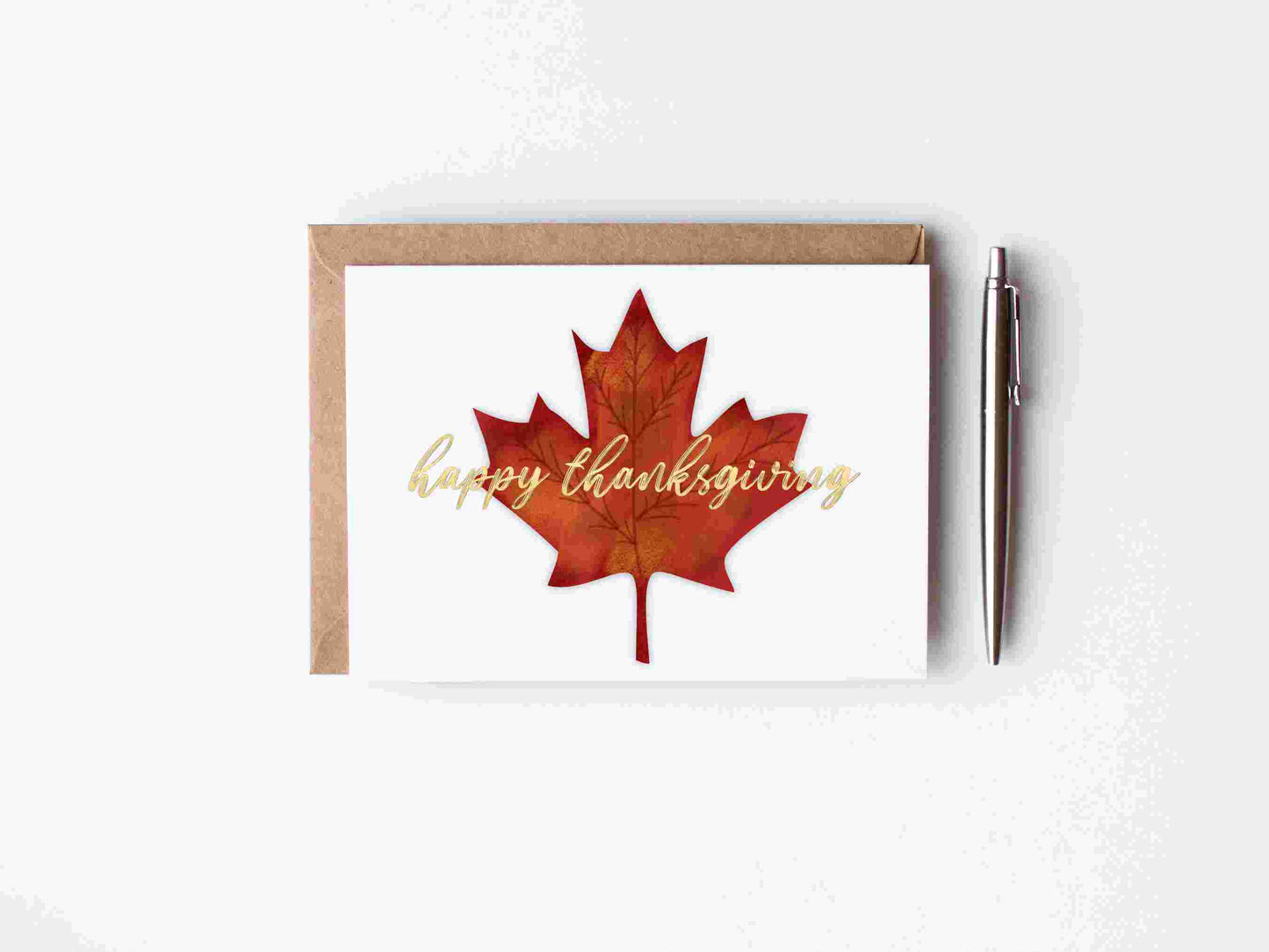 orange, red adn yellow maple leaf - fall foliage with gold doil lettering - happy thanksgiving